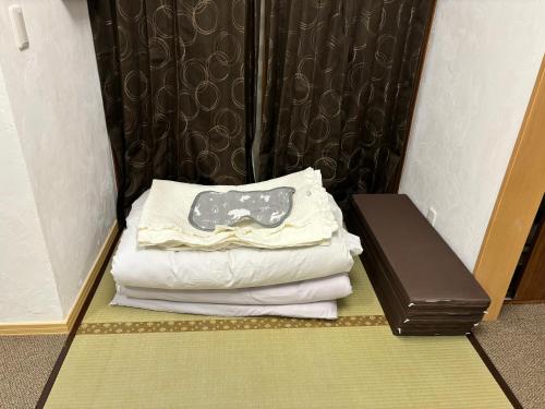 Postel nebo postele na pokoji v ubytování hanamaru-house 民泊一戸建ホテル