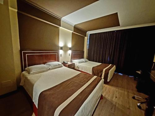 Ein Bett oder Betten in einem Zimmer der Unterkunft Hotel El Araucano