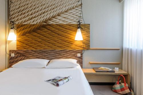 Ein Bett oder Betten in einem Zimmer der Unterkunft ibis Innsbruck