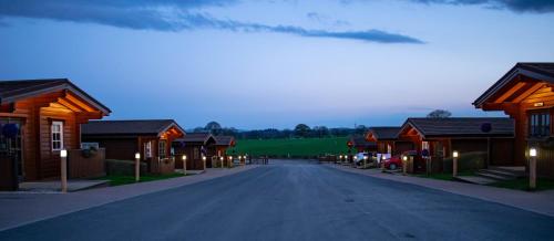 a street in a village with wooden buildings at Ingliston Country Club Hotel in Bishopton
