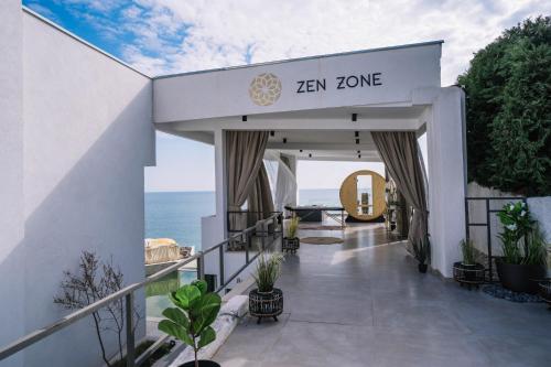 a view of the ocean from the balcony of a villa at Akrotiri Olympus Luxury Suites - Adults Only in Plaka Litochorou