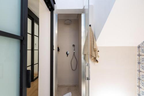 a bathroom with a shower in a room at Villa Fortuny Unique Home in Granada