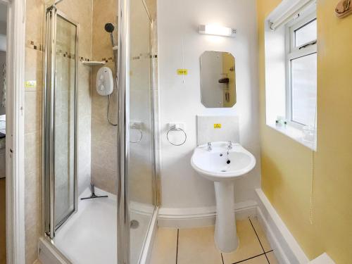 a bathroom with a sink and a shower at Chaplin in Legbourne