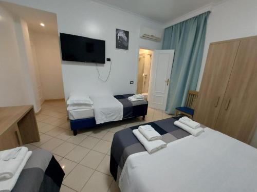 Ліжко або ліжка в номері Hotel Positano Suite