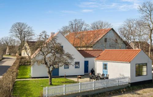 a white house with an orange roof at 3 Bedroom Amazing Home In Samsø in Kolby Kås
