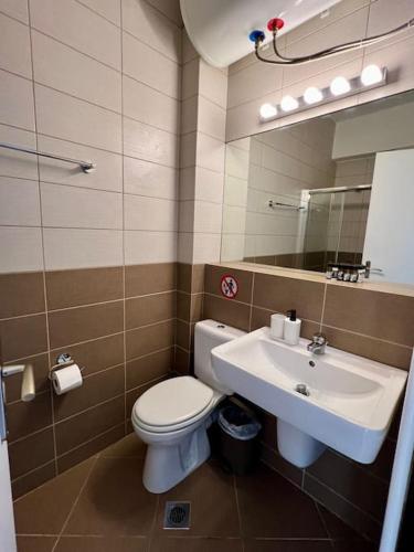 a bathroom with a toilet and a sink at D1 Serenity Studio in Athens