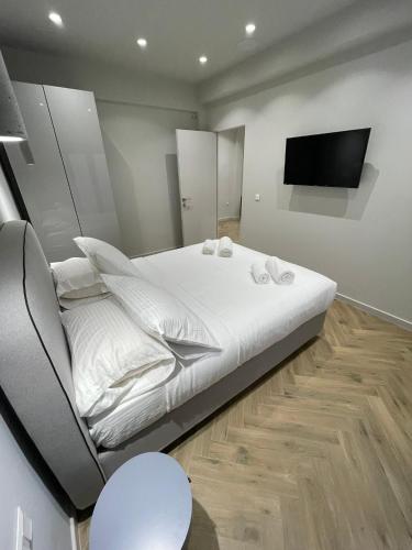 Ένα ή περισσότερα κρεβάτια σε δωμάτιο στο Down Town Nea Smyrni
