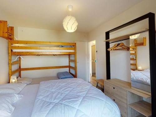 a bedroom with two bunk beds and a large bed at Maison Capbreton, 4 pièces, 8 personnes - FR-1-413-87 in Capbreton