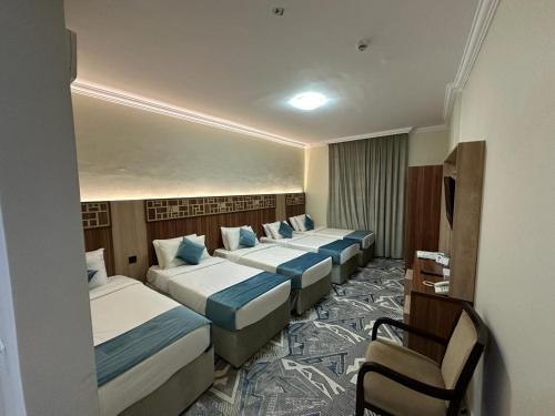 Postel nebo postele na pokoji v ubytování فندق اسكنت العزيزيه - Askant Al Azizyia Hotel