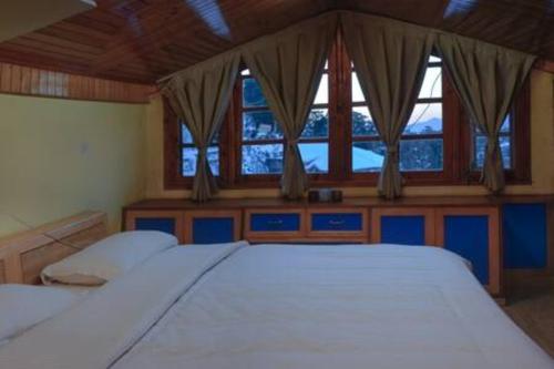 Postel nebo postele na pokoji v ubytování Kalawati Homes