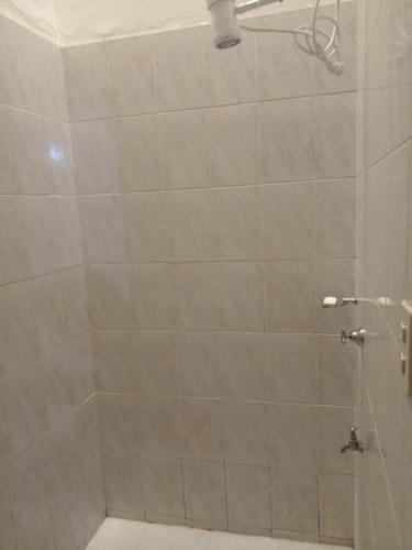 a bathroom with a shower with a glass door at mi Habitat in Asunción