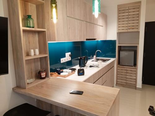 a kitchen with a counter with a sink and a counter sidx sidx sidx at Sea view - Luxury Apartments by Tyronne in Negombo