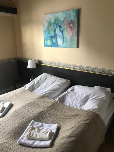Ένα ή περισσότερα κρεβάτια σε δωμάτιο στο Setesdal Motel & Apartments