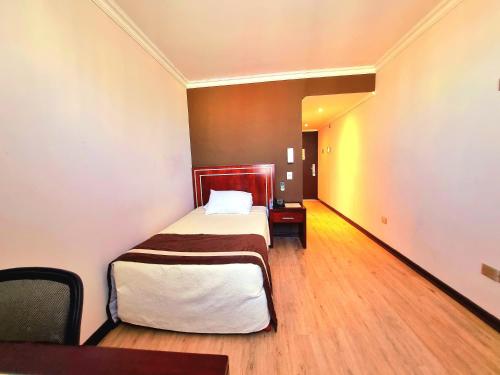 Ein Bett oder Betten in einem Zimmer der Unterkunft Hotel El Araucano