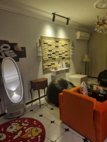 a living room with a child laying on a couch at ميدان سفنكس .جامعة الدول العربية in Cairo