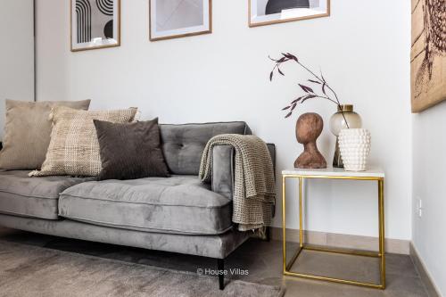 a living room with a couch and a table at Alma Suite in Noto