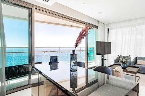 a living room with a view of the ocean at Del Mar Beachfront 3 Bedroom 'C' Residence in Limassol