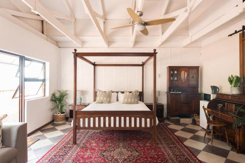 a bedroom with a bed and a ceiling fan at House Falcon close to ZAH in Pretoria