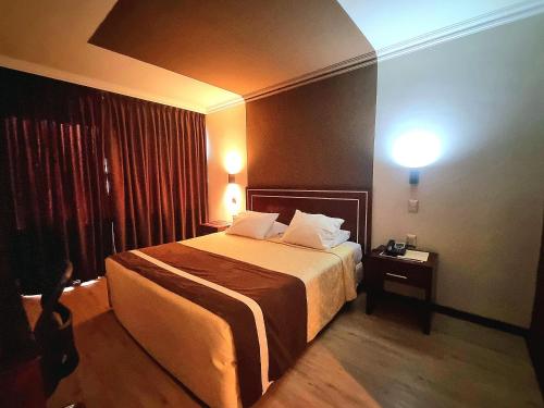 Ein Bett oder Betten in einem Zimmer der Unterkunft Hotel El Araucano