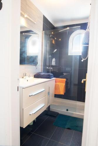 a bathroom with a sink and a shower at The 9 souls - pool view in Costa Teguise