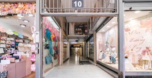 a shopping mall with a number sign on the wall at Monastiraki Heart - Luxury Apartment Athens in Athens