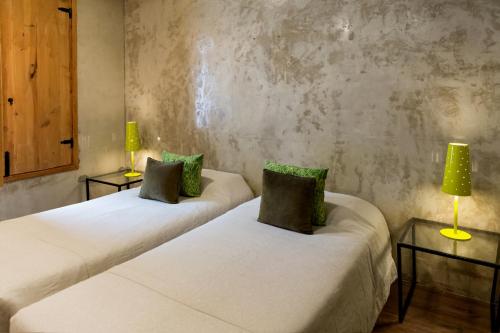 two beds in a room with two lamps at Lisbon Art Stay Apartments Baixa in Lisbon