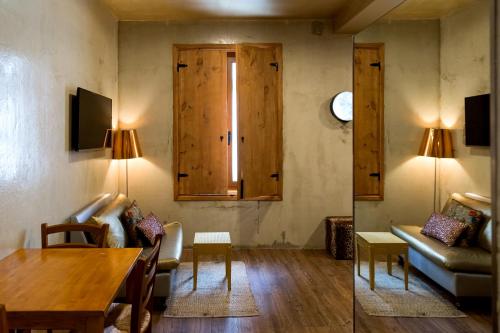 a living room with a table and a couch at Lisbon Art Stay Apartments Baixa in Lisbon