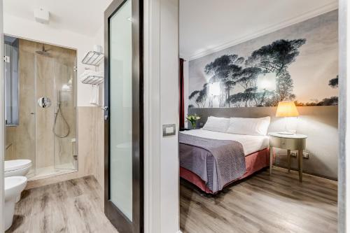 a bedroom with a bed and a bathroom with a shower at Residenza A -Via Veneto Fashion Rooms -self check-in in Rome