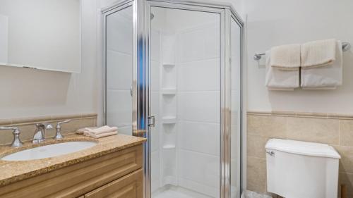 a bathroom with a shower and a sink at The Cliffside Resort Condominiums in Greenport