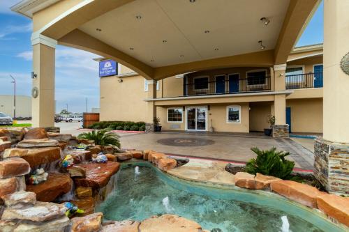 a pool in the middle of a building at Americas Best Value Inn - FM 529 in Houston