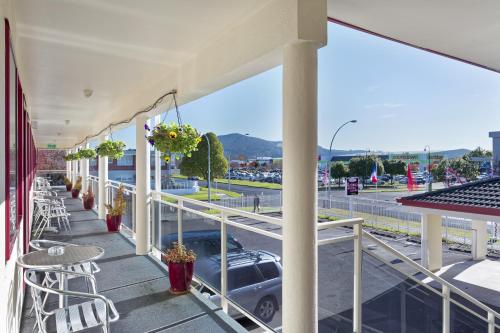 a balcony with a car parked on a street at BK's Rotorua Motor Lodge in Rotorua
