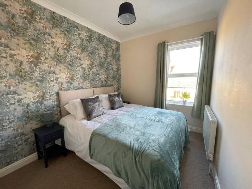 En eller flere senge i et værelse på 3-bed House In Grantham