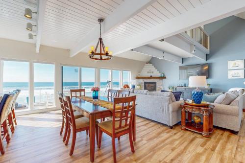 a dining room and living room with a table and chairs at Marine View in South Beach