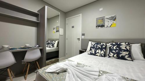 Llit o llits en una habitació de 09- Studio lindamente decorado! Ideal para casal!!!