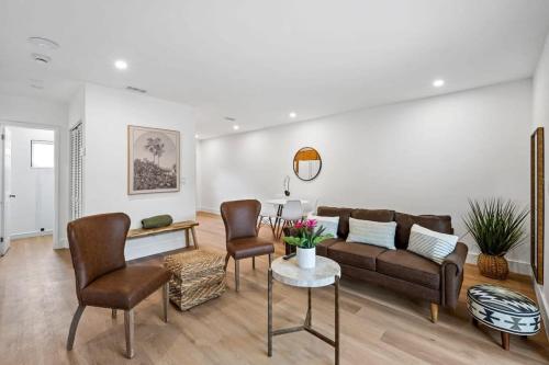 a living room with a couch and chairs and a table at Sailors Rest @ Sailboat Bend in Fort Lauderdale