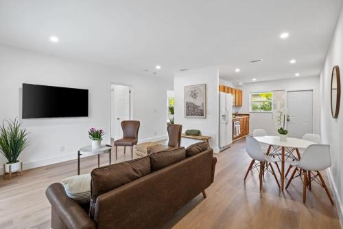 a living room with a couch and a table at Sailors Rest @ Sailboat Bend in Fort Lauderdale