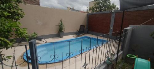 a swimming pool in the side of a building at CASACLUBGOLF in Santiago del Estero