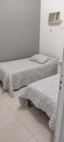 Un pat sau paturi într-o cameră la CASACLUBGOLF
