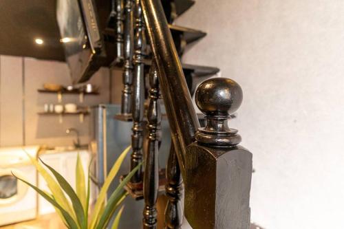 a tripod with a mirror in a room at SG Hideout Apartment Ben Thanh 374 Nguyen Cong Tru in Ho Chi Minh City