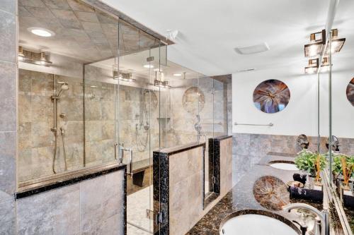 a bathroom with two sinks and a shower at Gorgeous historic Victorian with 8 bedroom/4 baths in Wildwood