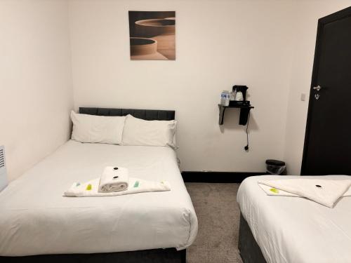 Ein Bett oder Betten in einem Zimmer der Unterkunft Ivy House Hotel