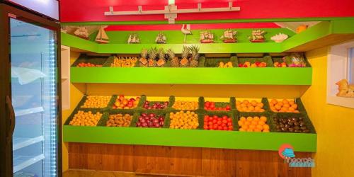 a display of fruits and vegetables in a store at Pinecraft Tiny Home 2 in Sarasota