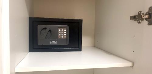 a microwave sitting on a shelf in a room at Apartment Niesenpoint in Albersdorf