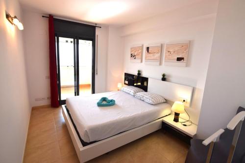 Posteľ alebo postele v izbe v ubytovaní Apartamento con piscina y vistas al mar ref 154