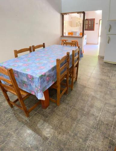 a dining room table with a colorful table cloth on it at Luz maria in Empedrado