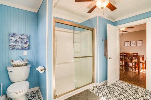 a bathroom with a toilet and a glass shower at Secluded Avinger Home with Lake Access! in Avinger