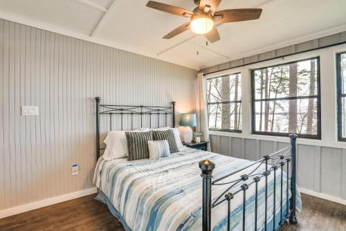 a bedroom with a bed and a ceiling fan at Secluded Avinger Home with Lake Access! in Avinger