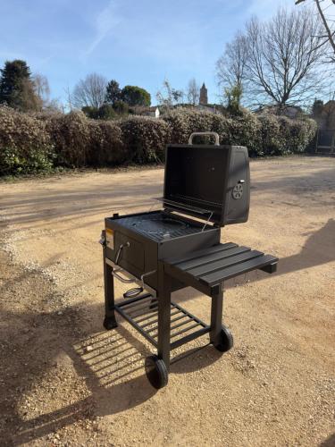 a bbq grill on a picnic table on the street at Affittacamere Ca' de Mazapedar in San Lorenzo