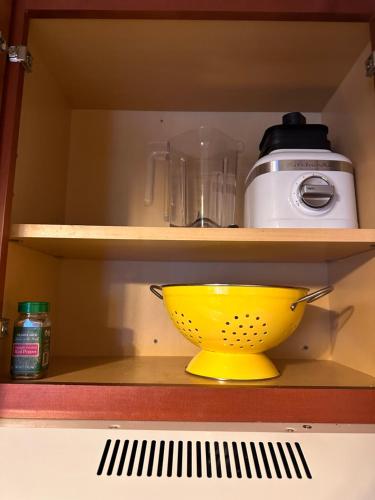 a yellow bowl on a shelf in a kitchen at Yosemite Condominium Loft unit -B202 in Yosemite West