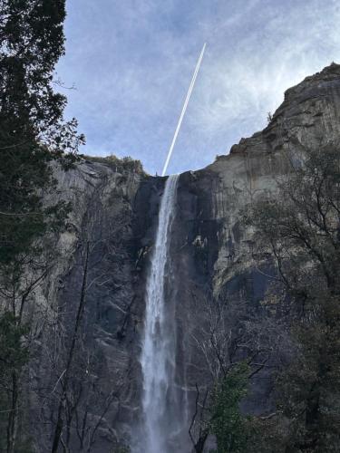 a jet plane flying over a waterfall at Yosemite Condominium Loft unit -B202 in Yosemite West